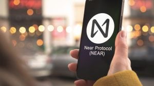 NEAR Protocol (NEAR-USD) logo on a smartphone held in a person's hand