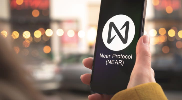 NEAR Protocol (NEAR-USD) logo on a smartphone held in a person's hand